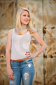 Young blonde caucasian girl alone on a street