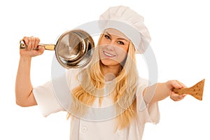 Young blonde chef woamn holds kitchenware as she prepares to coo