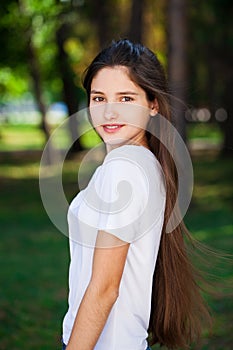 Young blonde girl with bare shoulders