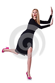 Young blonde girl in black dress pushing