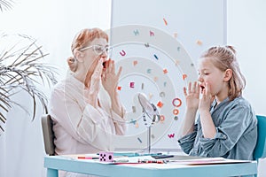 Girl learning to speak photo