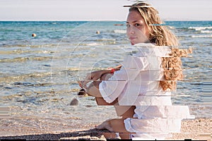 A young blonde girl in a white shirt pensive sits on the beach in Egypt. Exotic beauty. A high resolution. Glitch vintage shabby