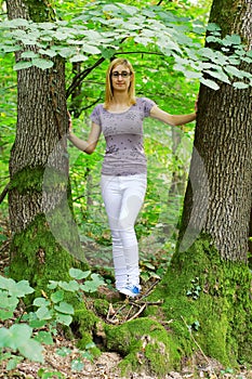 Young Blonde Girl In The Woods