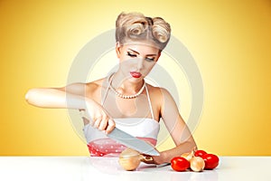 Young woman cutting onion