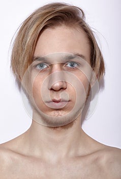 Young blonde man posing