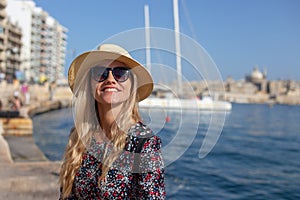 Young blonde Mediterranean traveler woman portrait at sea