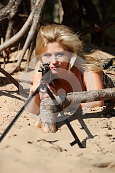 Young blonde with a rifle