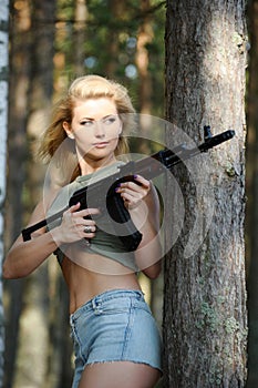 Young blonde with a rifle