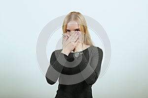 Upset Girl Covered Mouth With Her Hands, Is Silent. The Concept Of Suspicion