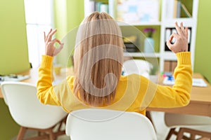 Young blonde woman business worker doing yoga exercise at office