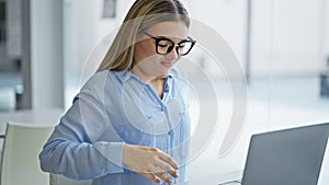 Young blonde woman business worker using laptop suffering for backache at office