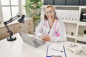 Young blonde woman doctor having telemedicine at clinic