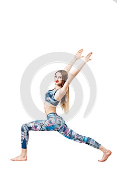 Young blonde woman doing fitness exercises, isolated on white background