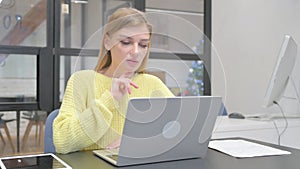 Young Blonde Woman Doing Video Chat on Laptop