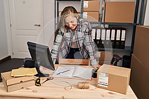 Young blonde woman ecommerce business worker smiling confident standing at office