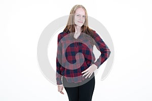 Young blonde woman hand on hips looking smiling blond girl in hipster shirt isolated on white background