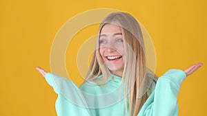 Young blonde woman laughing and looking at the camera