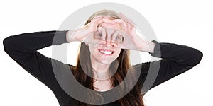 Young blonde woman make ok gesture glasses with hand fingers smiling eye looking through finger with happy face
