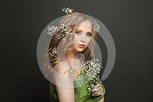 Young blonde woman with makeup and perfect hairstyle