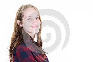 Young blonde woman portrait smiling and pensive in front of white copy space posing in close up portrait in studio shot