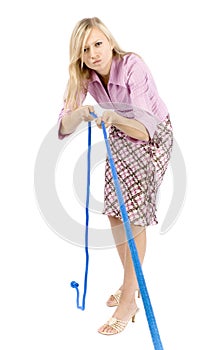 Young blonde woman pulling rope