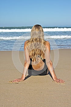 Young blonde woman relaxing on the beach