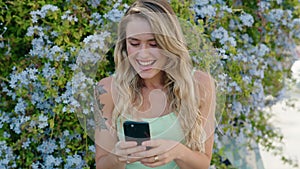 Young blonde woman smiling confident making selfie by the smartphone at park