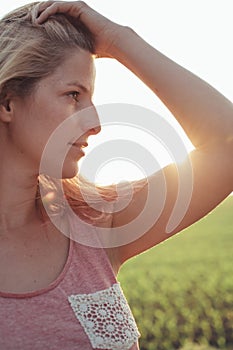 Young blonde woman at sunset.