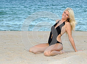 Young Blonde Woman in thought at beach