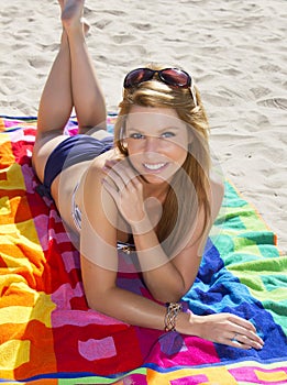 Young blonde woman vacationing at the beach