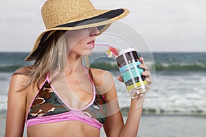 Young blonde woman vacationing at the beach