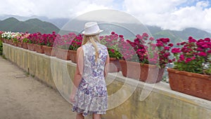 Young blonde woman walking in Ravello at Italy