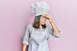 Young blonde woman wearing professional cook uniform and hat very happy and excited doing winner gesture with arms raised, smiling
