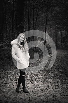 Young blonde woman in woods
