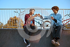 Young bmx bikers leisures on ramp in skatepark