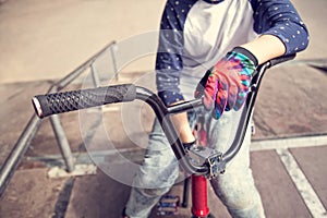 Young BMX rider boy sitting on a bicycle