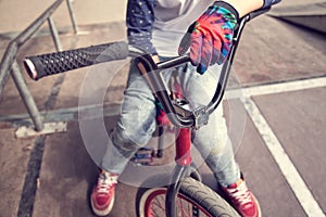 Young BMX rider boy sitting on a bicycle