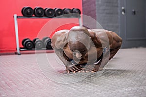 Young bodybuilder doing excercises