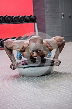 Young bodybuilder doing excercises