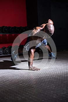 Young Bodybuilder doing One-armed push ups