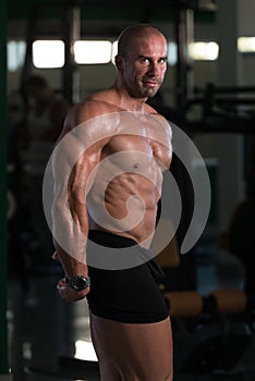 Young Bodybuilder Flexing Muscles