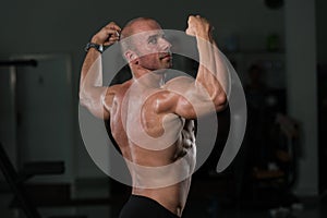 Young Bodybuilder Flexing Muscles