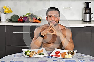 Young bodybuilder in the kitchen