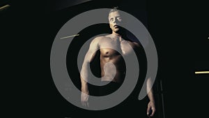 Young bodybuilder posing in a gym