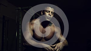 Young bodybuilder posing in a gym