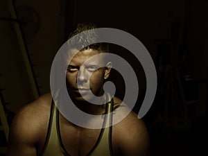 Young bodybuilder posing in a gym