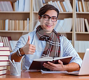 Young book writer writing in library