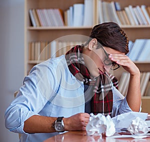 Young book writer writing in library