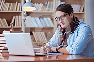 The young book writer writing in library