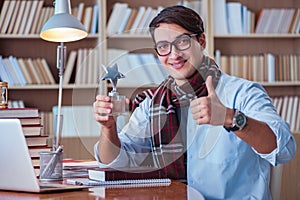 The young book writer writing in library